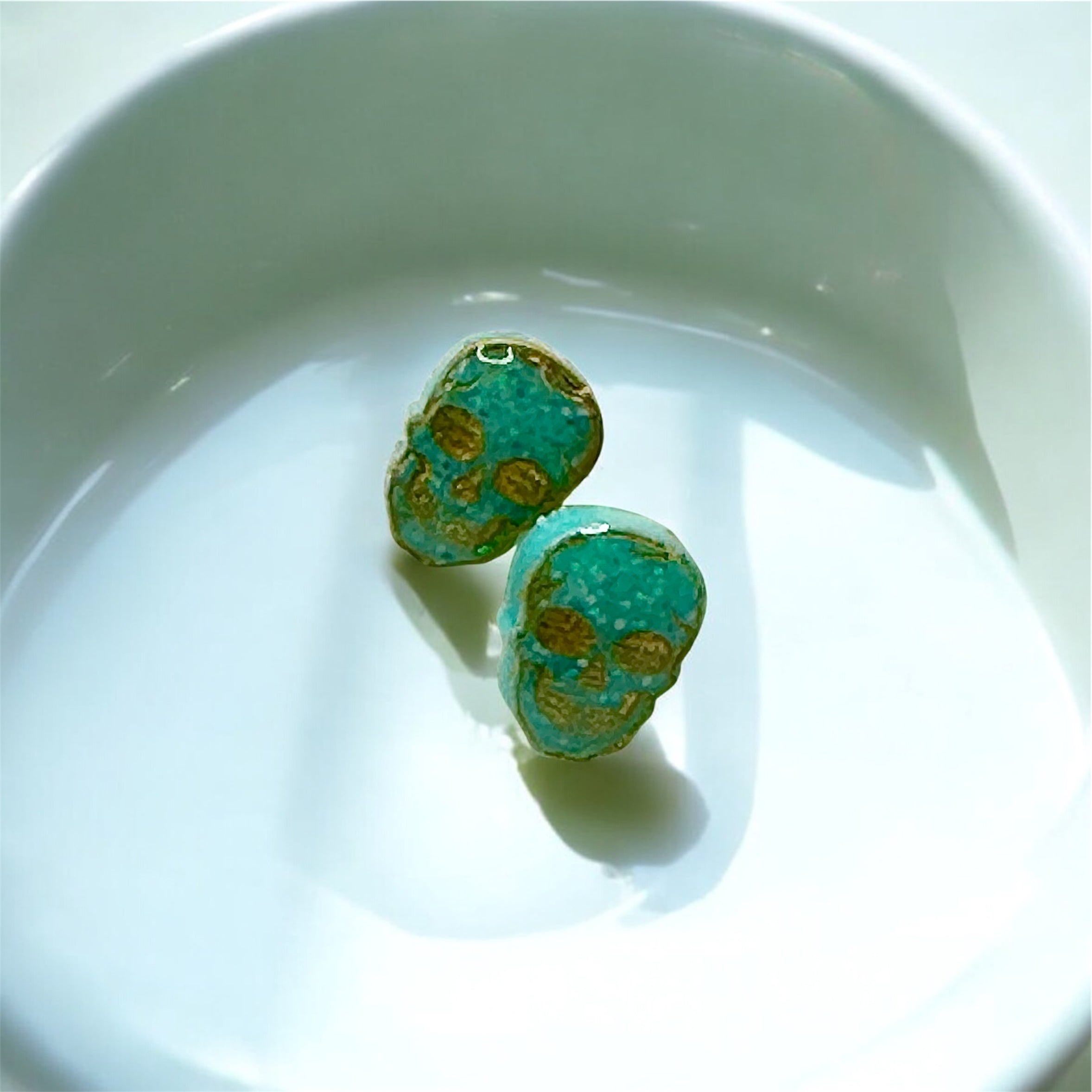 Seafoam Resin Skull Studs